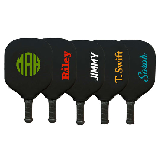 Personalized pickleball paddle covers featuring names and initials, showcasing durable neoprene construction.